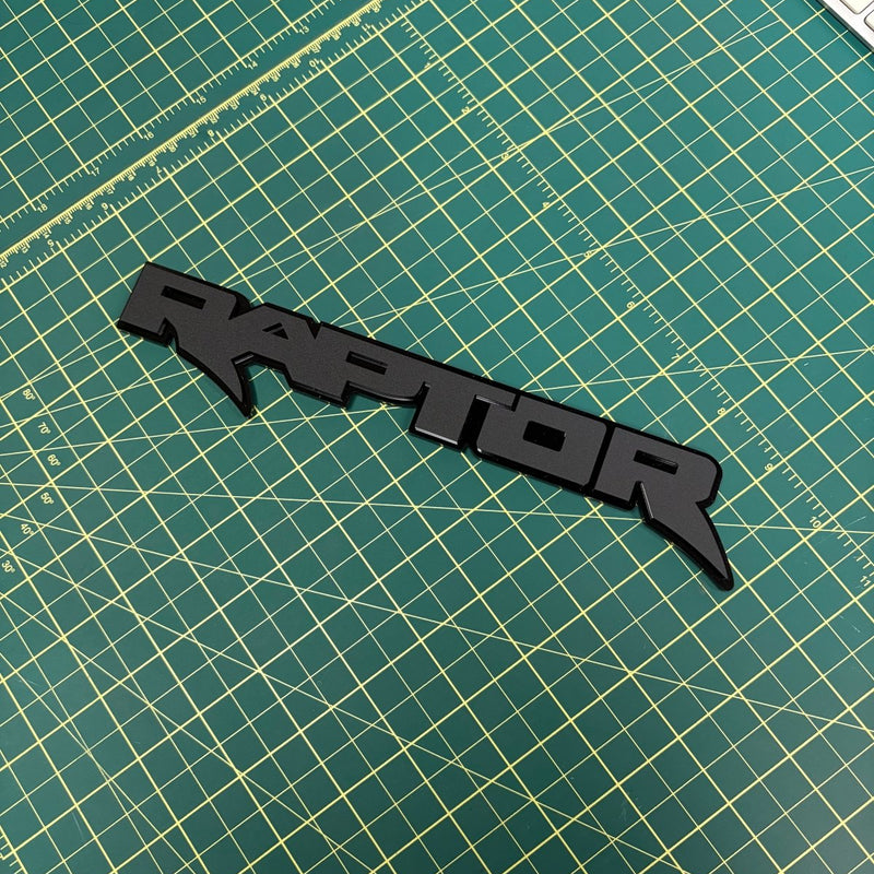 Load image into Gallery viewer, Raptor Emblem in matte black on green mat