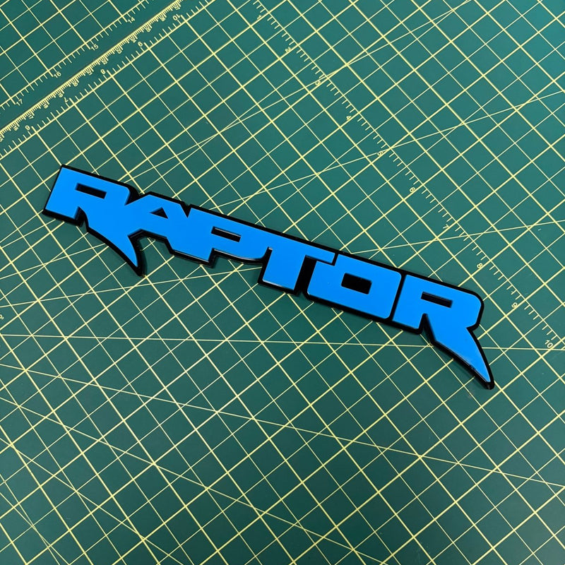 Load image into Gallery viewer, Raptor emblem in nitrous blue on green mat