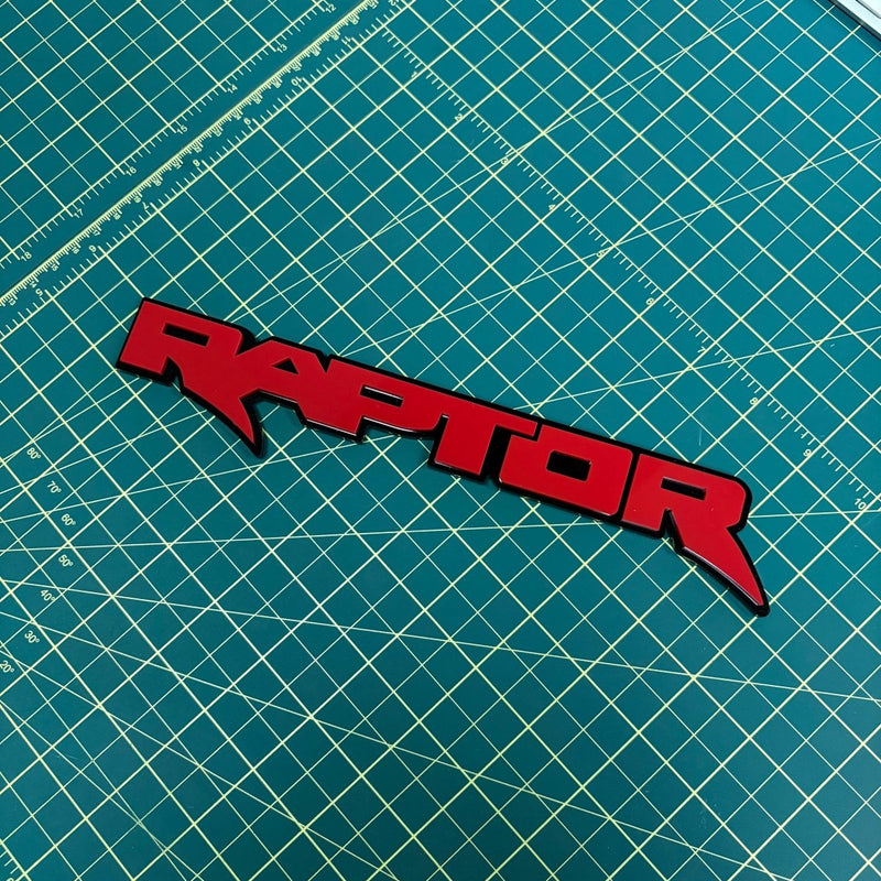Load image into Gallery viewer, "Raptor" emblem in red on green mat
