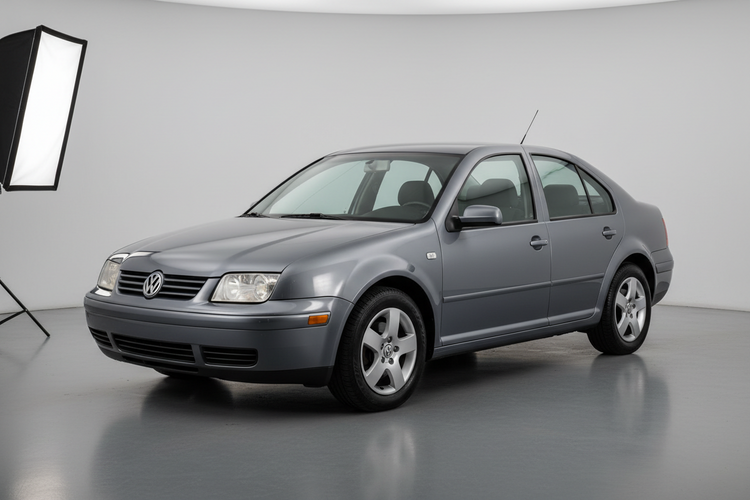 Picture of a Volkswagen Jetta on gray floor and white background.