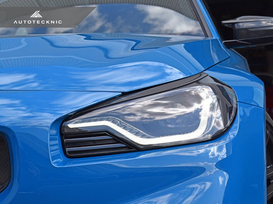 BMW G87 M2 - Carbon Fiber Headlight Trim Set - FSPE