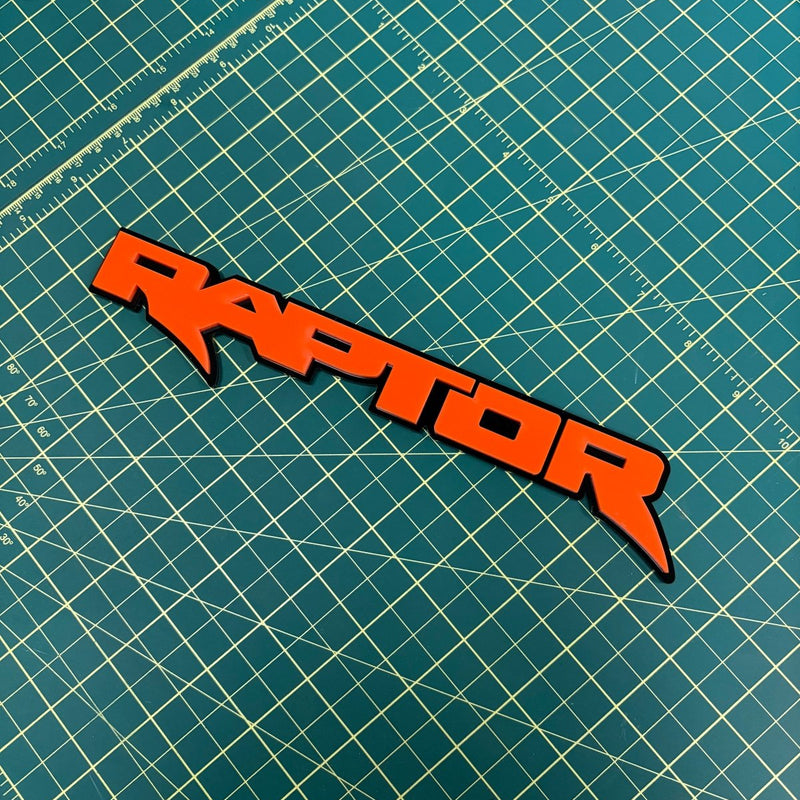 Load image into Gallery viewer, Raptor Emblem in Orange on green mat
